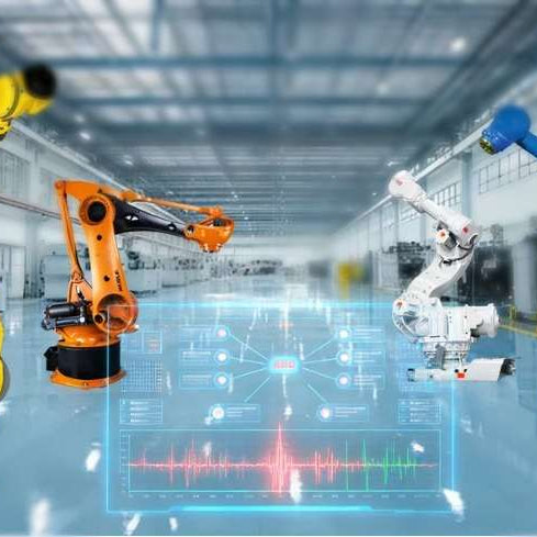An engineer examining an active YASKAWA robot pendant displaying major communication alarm codes, positioned next to a FANUC teach pendant showing an FSSB link error, to diagnose serial pulse coder feedback faults.