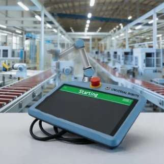 An operator pressing the backside Freedrive button on a Universal Robots teach pendant to manually verify joint brake release states on a CB3 collaborative robot arm with no active alarms.